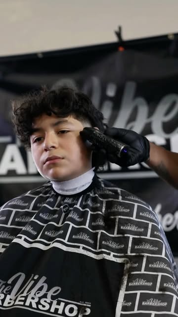 Client in the chair at The Vibe Barbershop