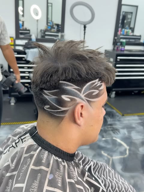 Custom freestyle hair design on a fade